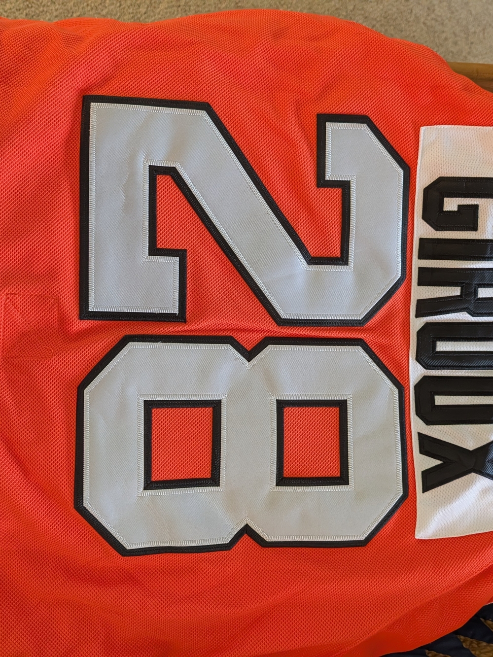 CCM Orange Mesh Jersey with White and Black Number 28